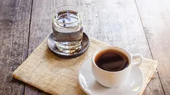 Why a cup of coffee should be accompanied by a glass of water